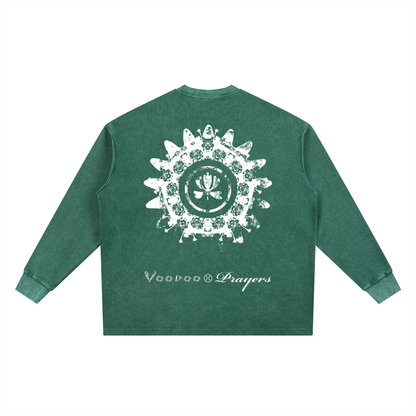 Green long-sleeve shirt with white graphic design and text on a white background
