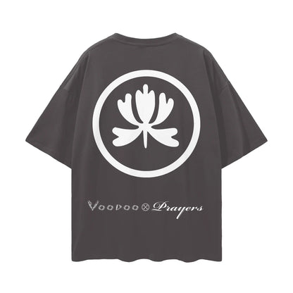 Black oversized t-shirt with bold white floral emblem and Voodoo Prayers text on back