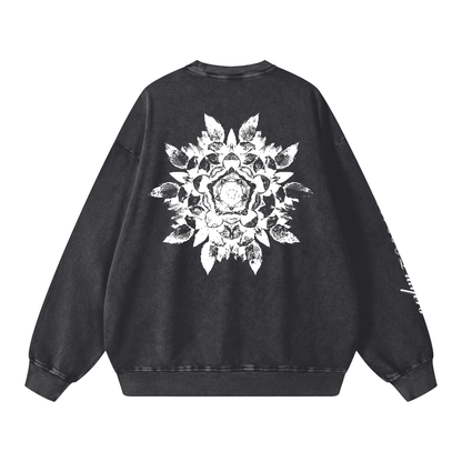 Black sweatshirt with a white floral design on the back against a white background