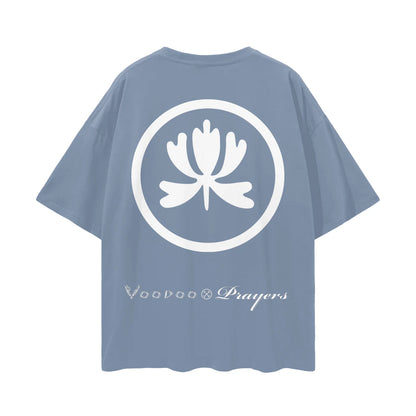Blue oversized t-shirt with white lotus graphic and Voodoo Prayers text on the back