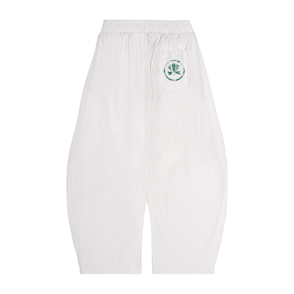 White pants with a green logo on a white background