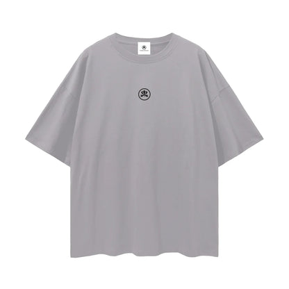 Oversized grey T-shirt with small black abstract logo on chest, streetwear style