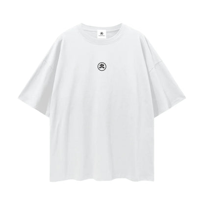 White oversized t-shirt with small black abstract graphic on chest, minimalist streetwear style