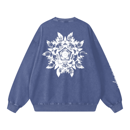 Blue sweatshirt with a white floral design on the back against a white background