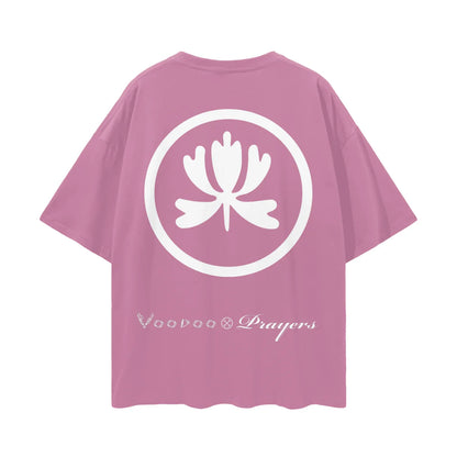 Pink oversized t-shirt with white lotus emblem and stylized lettering on the back.