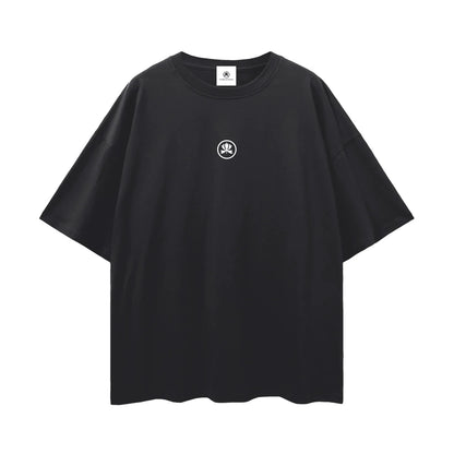 Black oversized t-shirt with small white abstract logo on the chest, streetwear style
