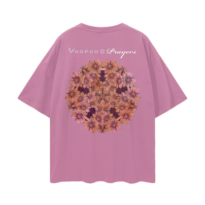 Pink oversized t-shirt with kaleidoscopic floral mandala and 'Voodoo Prayers' text on back