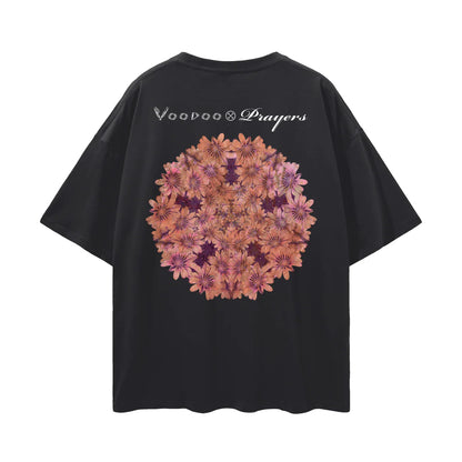 Black oversized t-shirt with kaleidoscope floral mandala and 'Voodoo Prayers' text on back.