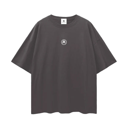 Black oversized t-shirt with small white abstract logo on chest, streetwear fashion