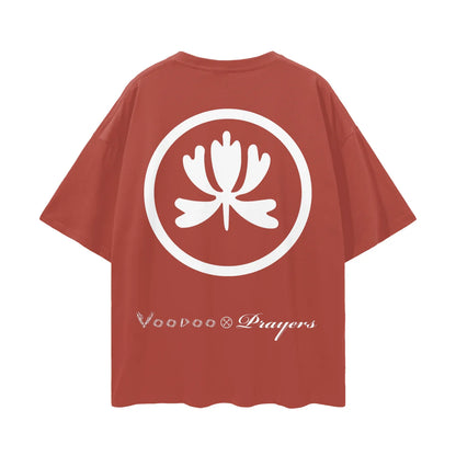 Red oversized t-shirt with large white lotus emblem and stylized 'Voodoo Prayers' text on back