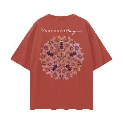 Rust-colored t-shirt with floral mandala graphic and unique typography on the back