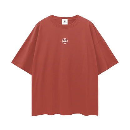 Oversized rust red t-shirt with small white abstract logo on chest, minimalist streetwear
