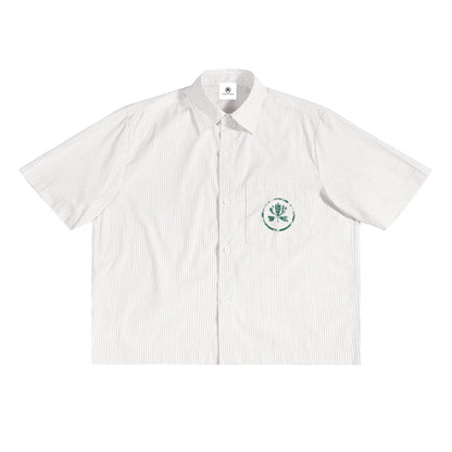 White short-sleeve striped button-up shirt with green chest pocket graphic