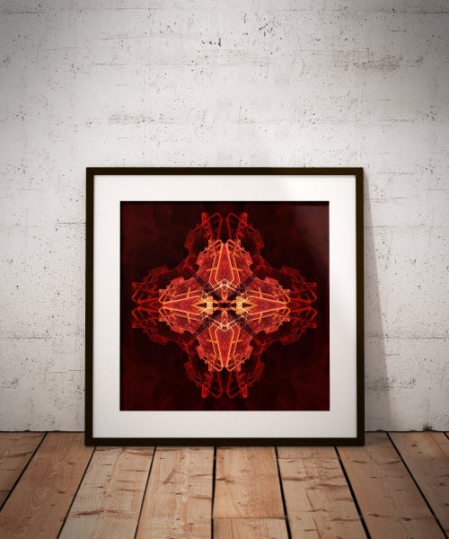 Framed abstract art print with red and orange design on a white brick wall.
