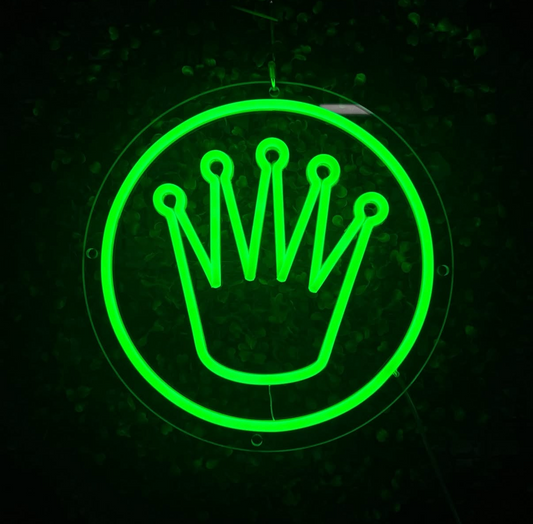 Glowing LED green rolex crown logo light on a dark background