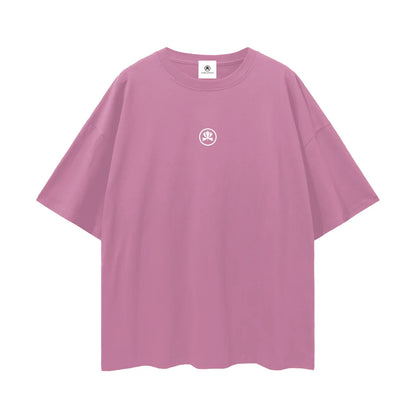 Pink oversized t-shirt with small white club culture logo at center chest
