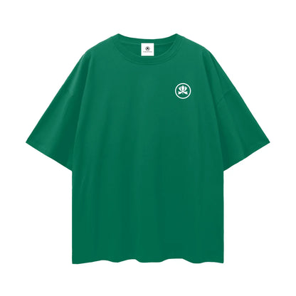 Green oversized t-shirt with white spiritual hand symbol graphic on chest