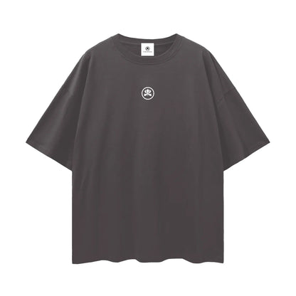 Oversized black t-shirt with small white abstract logo on chest, minimalist streetwear style
