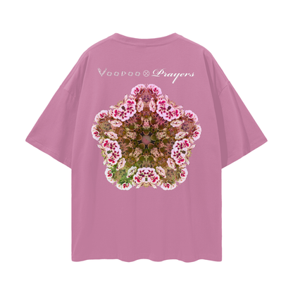 Pink t-shirt with floral design and text on a white background