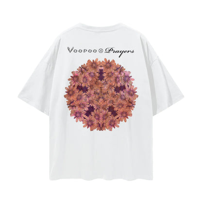 White oversized t-shirt with kaleidoscope floral graphic and Voodoo & Prayers text on back