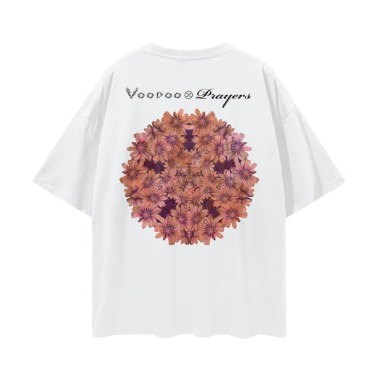 White oversized t-shirt with kaleidoscope floral graphic and Voodoo & Prayers text on back