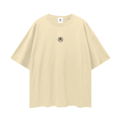 Beige oversized t-shirt with small black graphic symbol on chest, minimalist streetwear style