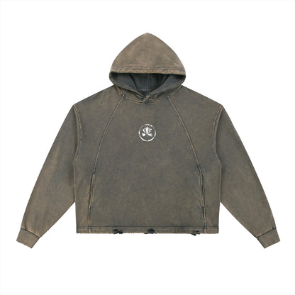 Washed brown cropped hoodie with small white crest graphic on chest, distressed hem.