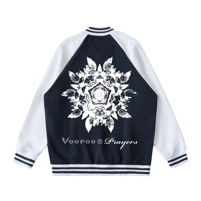 Black and white varsity jacket with bold floral mandala graphic and text on the back