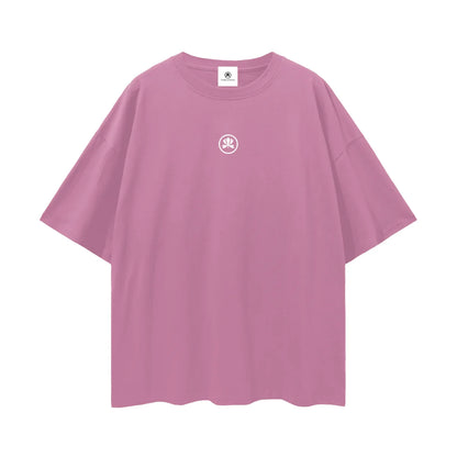 Pink oversized t-shirt with small white graphic logo on chest, streetwear fashion