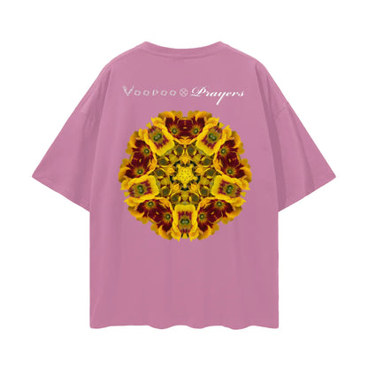Pink oversized t-shirt with kaleidoscopic yellow flower graphic and white text on back.